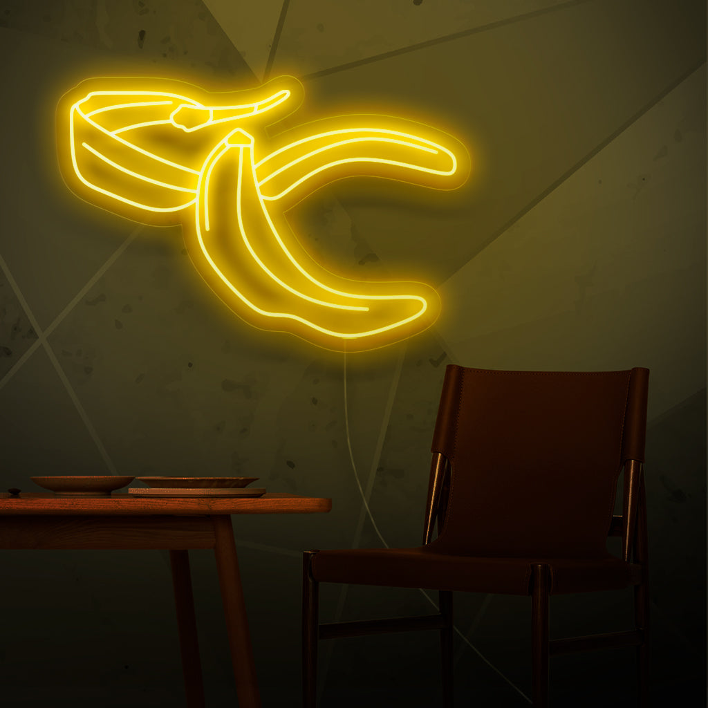 "Banana Peel Neon Sign" - Ένα ιδιόρρυθμο φως νέον που χαρακτηρίζει την παιχνιδιάρικη αναπαράσταση μιας φλούδας μπανάνας, εμπνέοντας χιούμορ και ανάλαφρη καρδιά στον χώρο σας.
