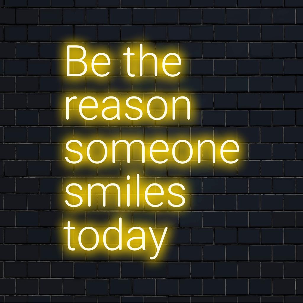 Handmade LED neon sign with Be The Reason Someone Smiles Today uplifting quote; custom neon light decor.