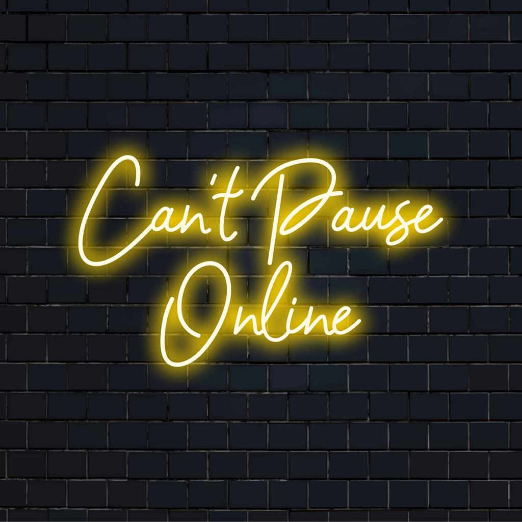 Custom LED neon sign with the phrase Can't Pause Online 2 glowing vibrantly, perfect for a modern space.