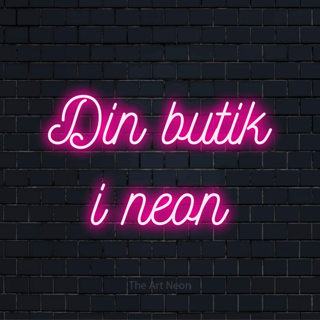 Personligt neonskilt med teksten “Din butik i neon” på en sort murstensvæg