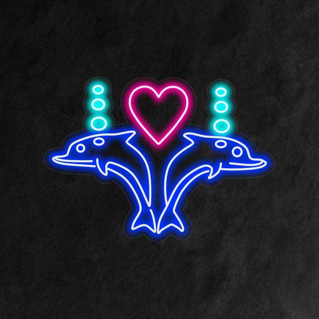 "Dolphins In Love With Heart Neon Sign" je umělecký a náladový doplněk do vašeho interiéru. Neonové světlo, které zobrazuje krásu zamilovaných delfínů a vytváří podmanivou atmosféru.