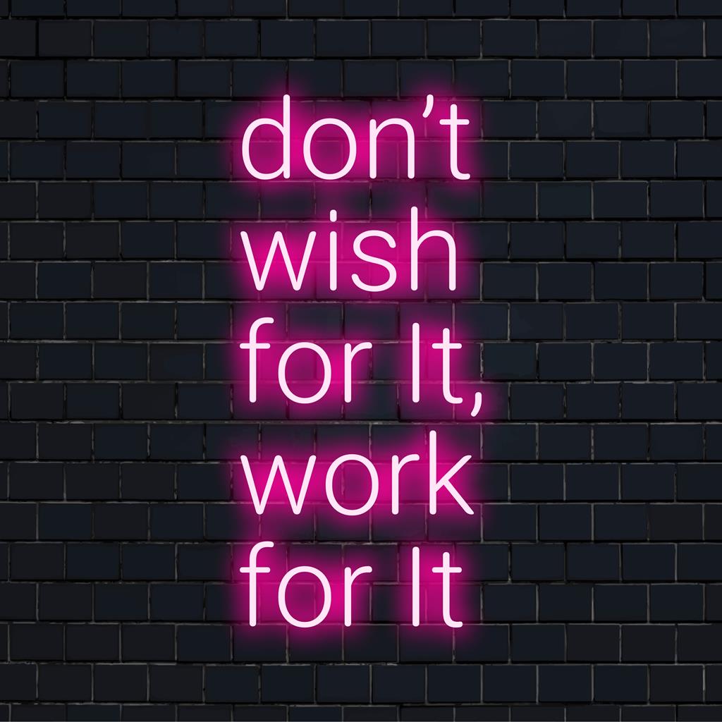 Custom LED neon sign with vibrant letters spelling Don't Wish For It, Work For It for inspiring decor. Neon quote art.