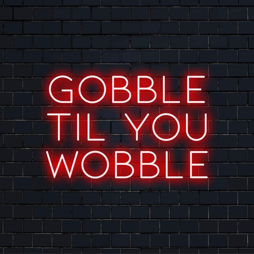 Custom LED neon sign featuring the whimsical phrase Gobble Til You Wobble, perfect for festive neon decor.