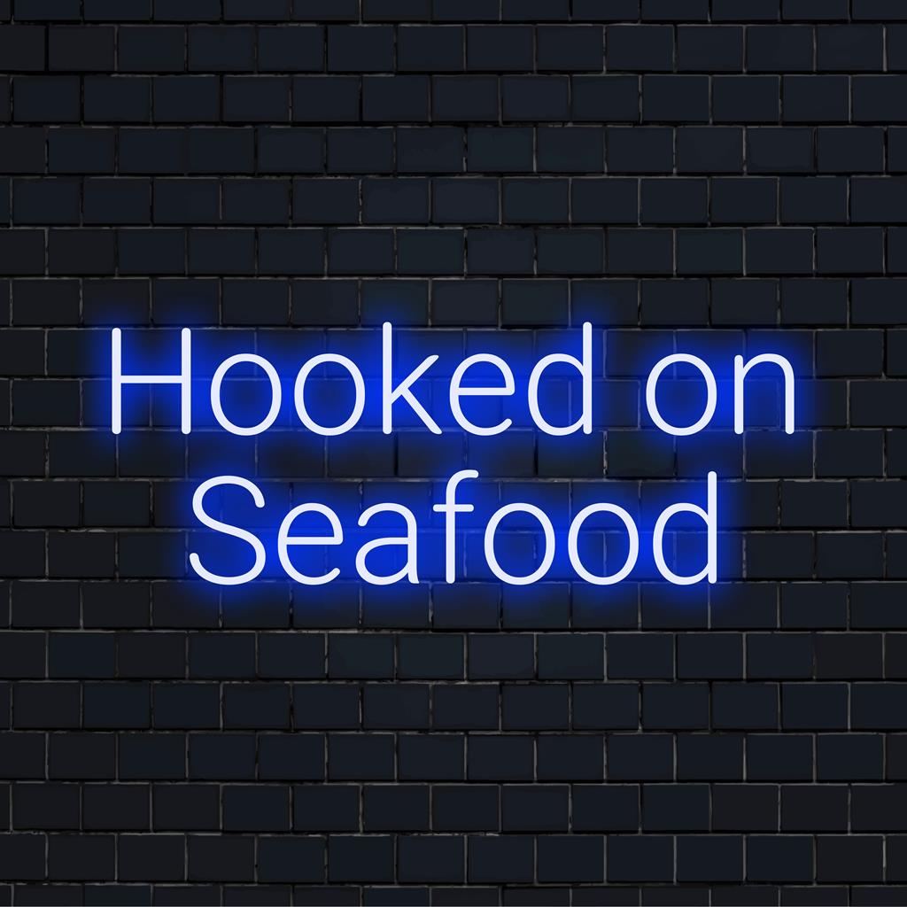 Skræddersyet LED Neon-skilt Hooked On Seafood ��� levende neonlys perfekt til hav-tema indretning eller personlig stemning.