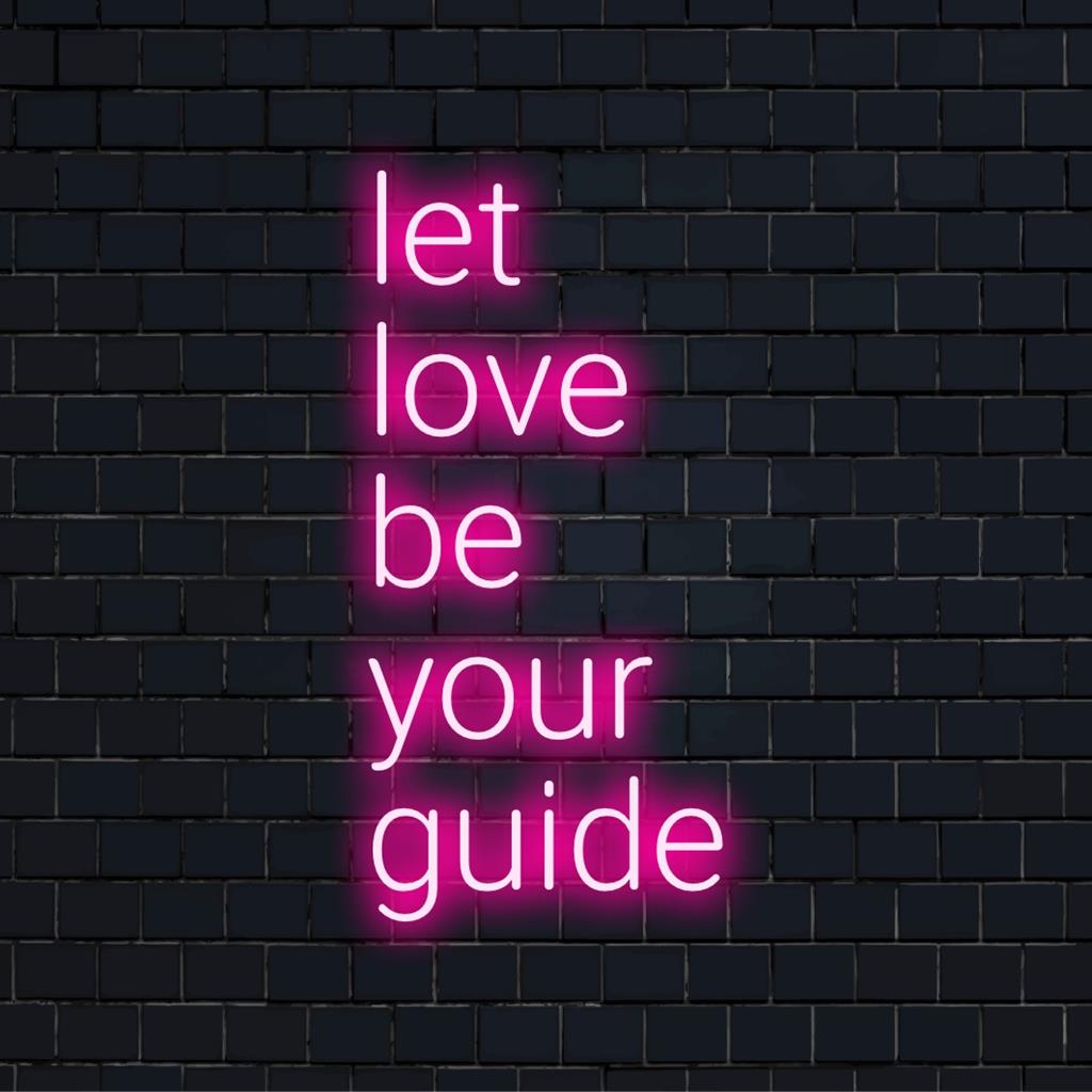 Vibrant LED neon sign reading Let Love Be Your Guide, blending art and light to brighten spaces with positive energy.
