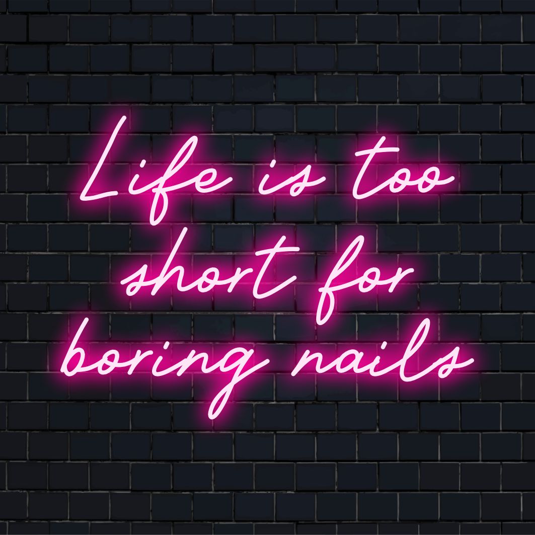 A vibrant, custom LED neon sign highlighting the lively mantra: Life Is Too Short For Boring Nails, perfect for any space.