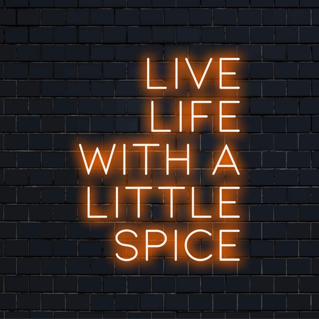 Custom LED neon sign displaying Live Life With A Little Spice in vibrant colors for unique decor or branding.