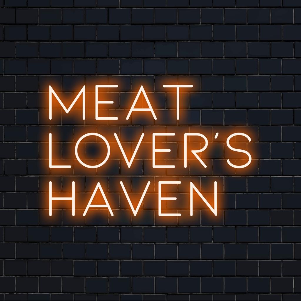 Skræddersyet LED-neonskilt, der læser Meat Lover's Haven, der kombinerer levende neonfarver for en slående visuel effekt.