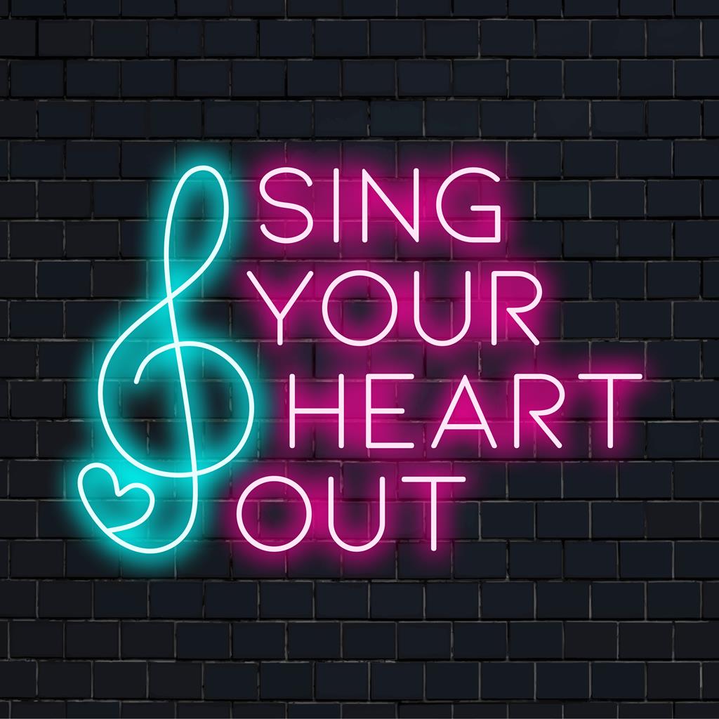 Custom LED neon sign with Sing Your Heart Out text, vibrant neon art for personal expression and decor.