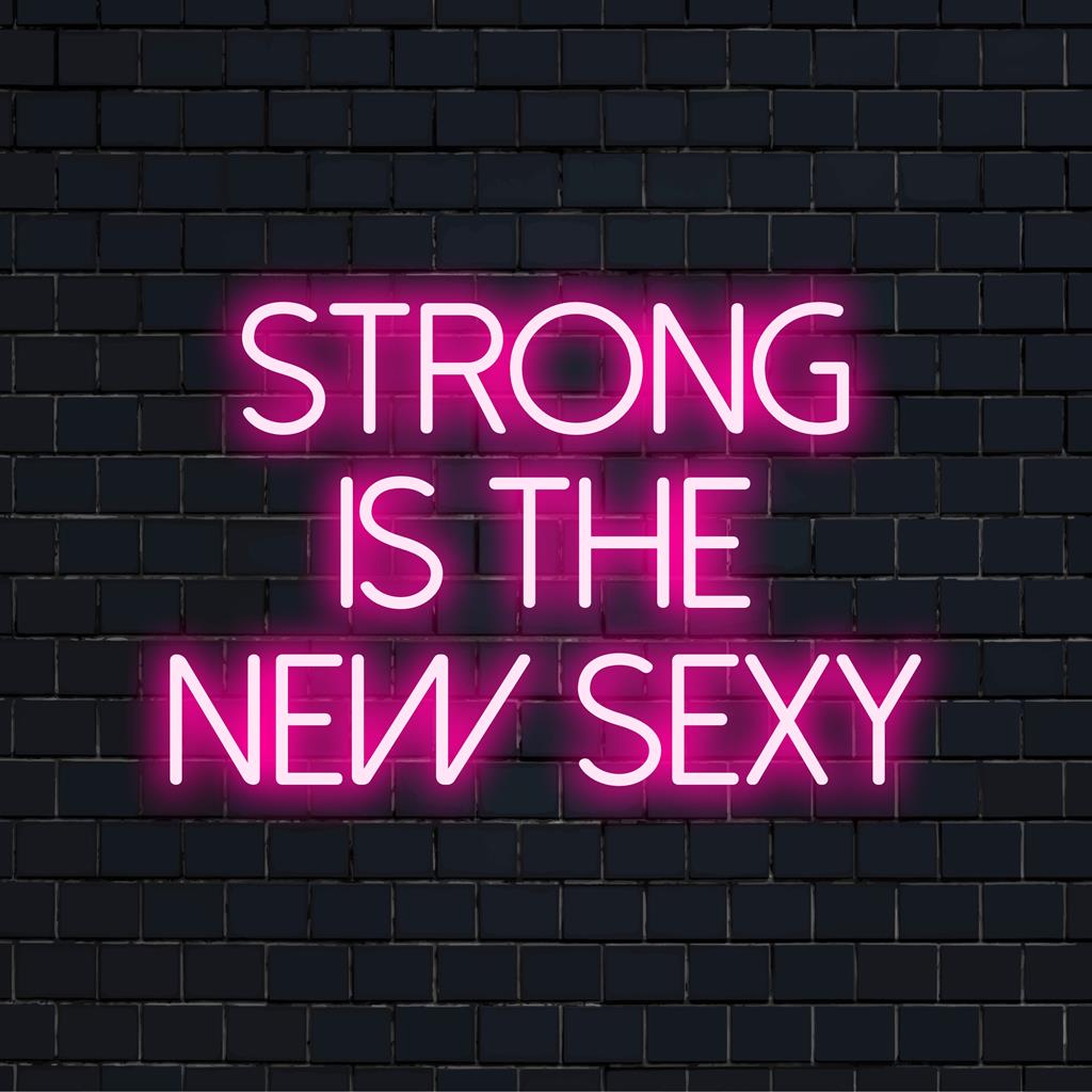 Πινακίδα νέον LED με τη φράση Strong Is The New Sexy. ζωντανή, κινητήρια τέχνη τοίχου που φωτίζει με λαμπερά χρώματα.