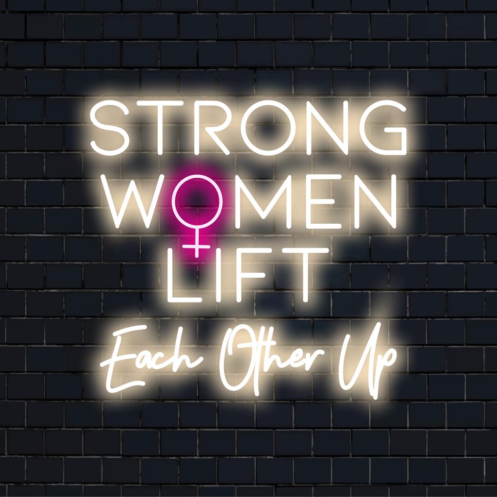 Custom-made LED neon sign with the quote Strong Women Lift Each Other Up in stylish script, perfect for modern decor.