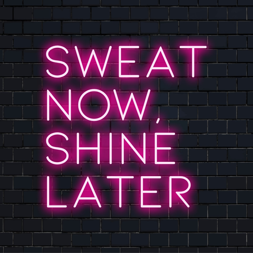 Custom LED neon sign featuring the motivational quote Sweat Now, Shine Later, perfect for inspirational wall decor.