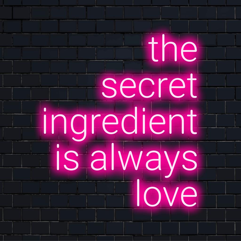 Custom LED neon sign with The Secret Ingredient Is Always Love in captivating cursive, perfect for any wall decor.