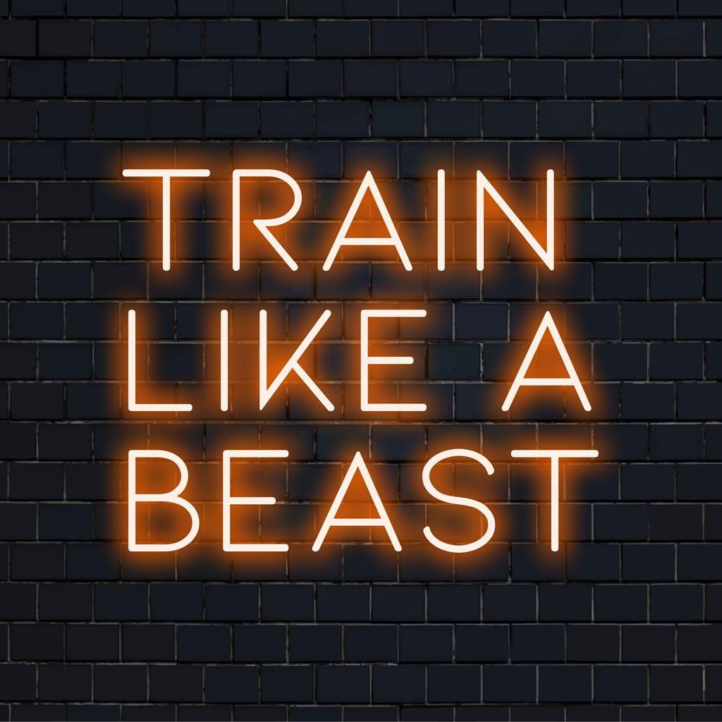 Custom LED neon sign glowing Train Like A Beast, ideal for motivation, gym decor, and setting an empowering atmosphere.