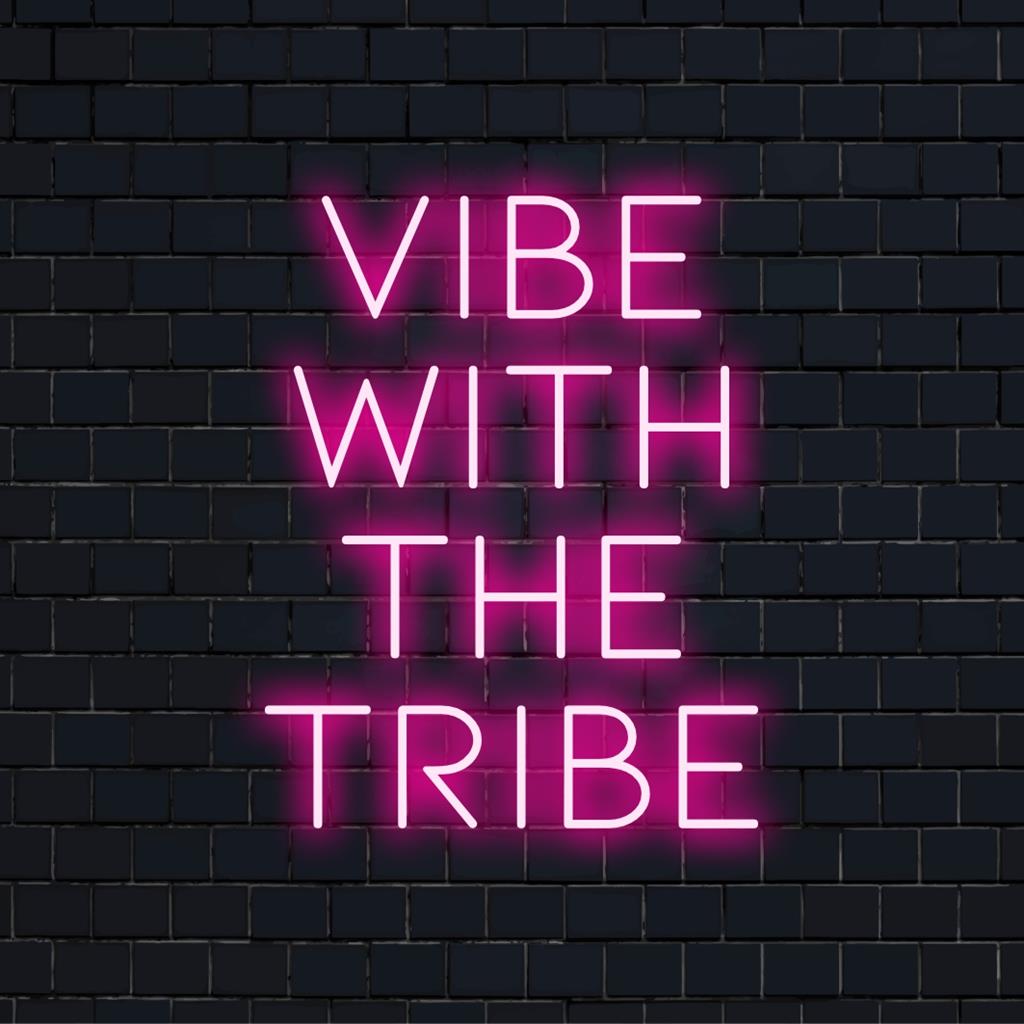 Custom LED neon sign reading Vibe With The Tribe in vibrant colors; perfect for unique wall decor and home ambiance.