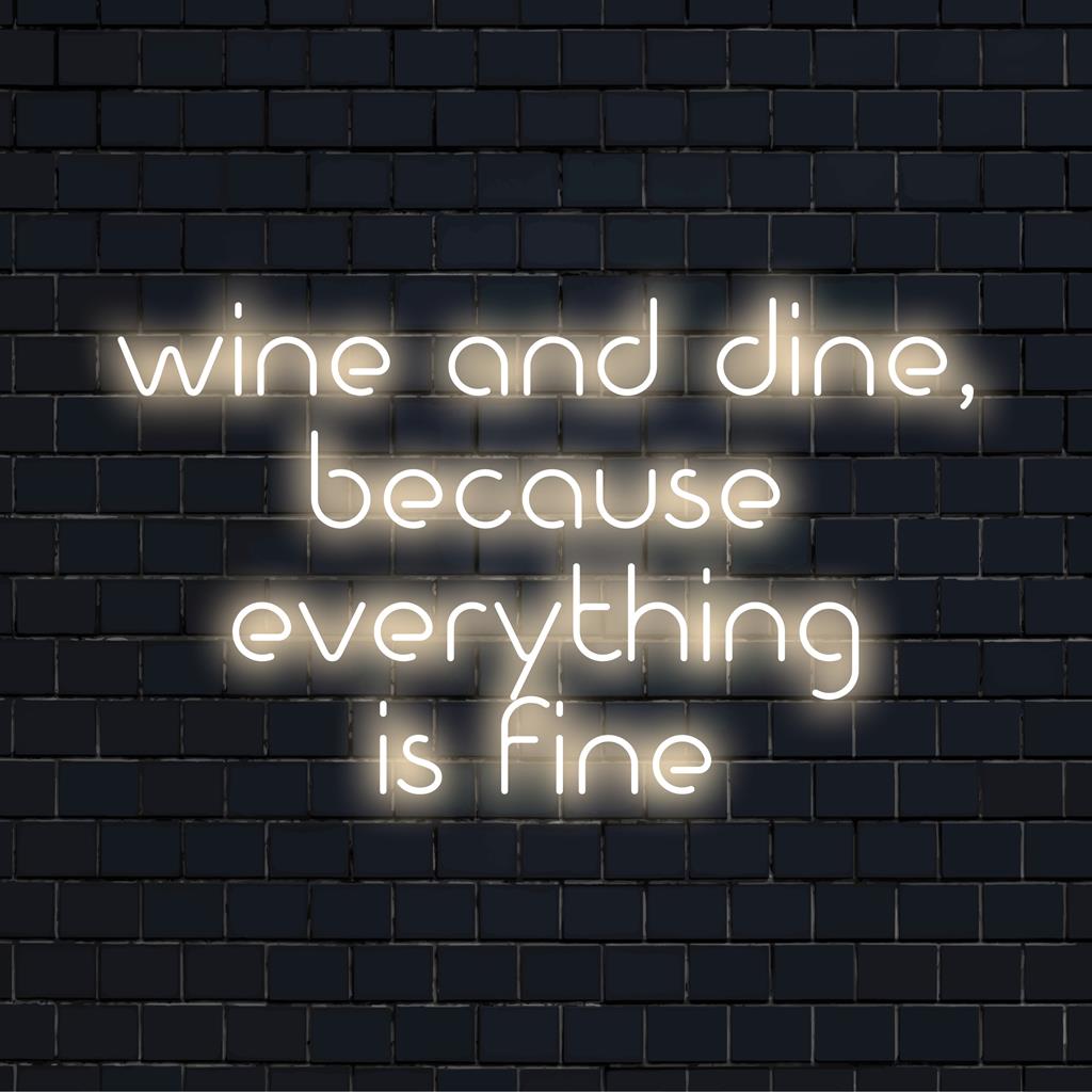 Custom LED neon sign displaying Wine And Dine, Because Everything Is Fine in vibrant colors, perfect for cozy spaces.
