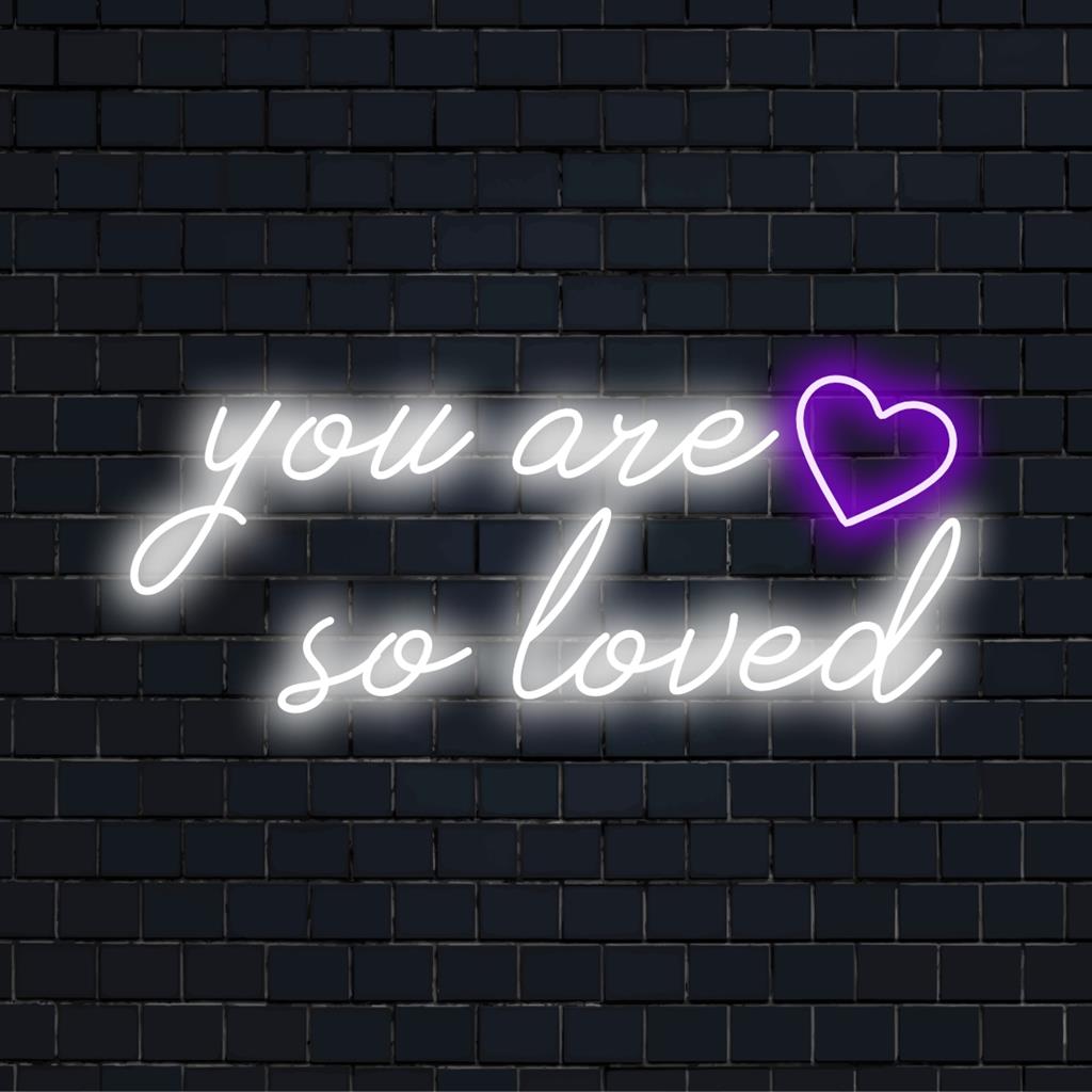 You Are So Loved neon sign; vibrant LED wall art illuminating warm, encouraging words. Perfect for any space needing upliftment.