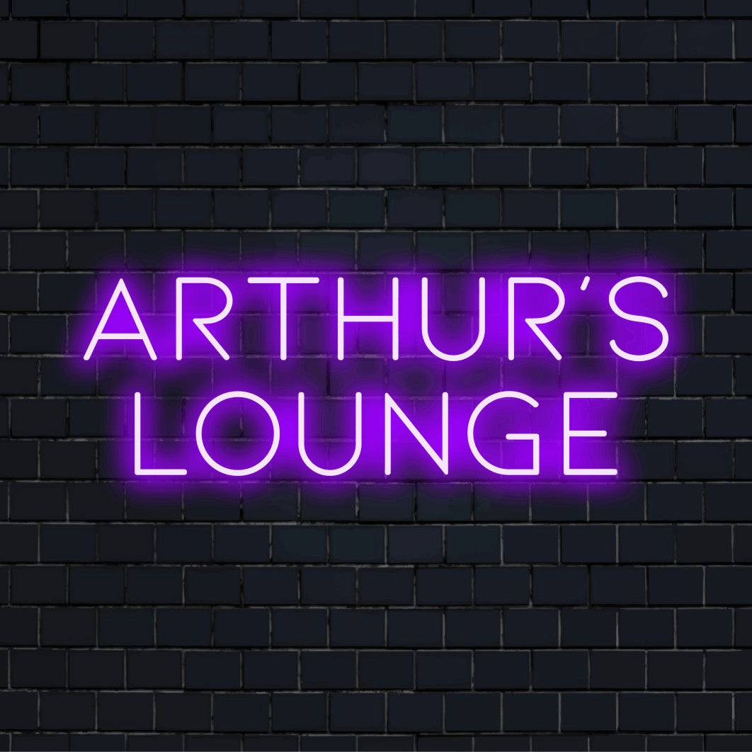 Arthur_s Lounge Personalized LED Neon Sign, bright neon lettering against black brick wall