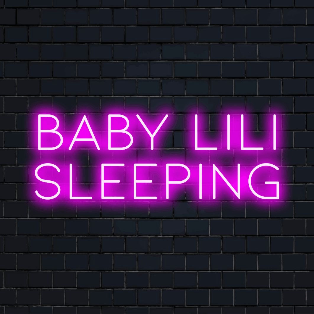 Baby Lili Sleeping Personalized LED Neon Sign, bright neon lettering on dark brick background
