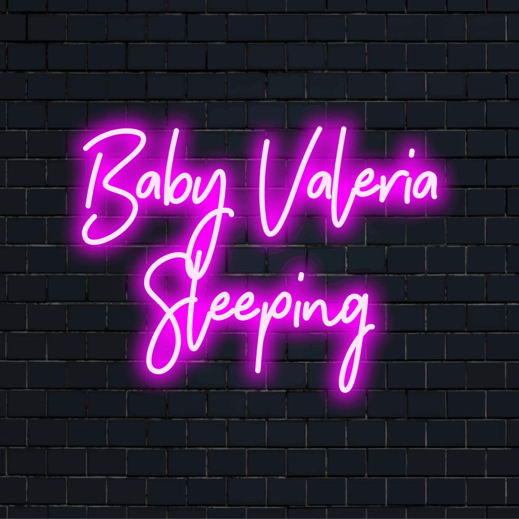 Baby Valeria Sleeping Personalized LED Neon Sign, glowing neon text on dark brick background