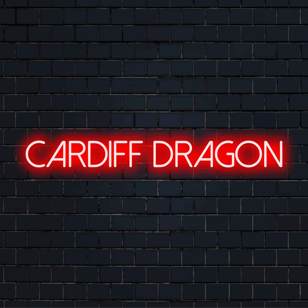 Cardiff Dragon Neon Sign, bright LED glow on black brick background
