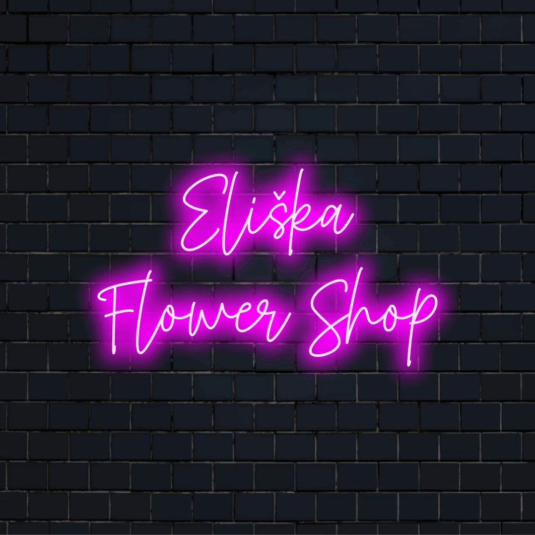 Eliska Flower Shop Custom Name Neon Sign, bright neon lettering on dark brick wall