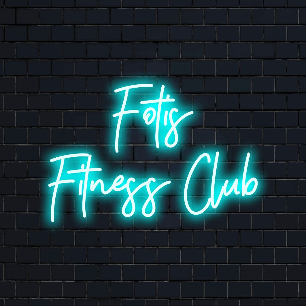 Fotis Fitness Club Personalized Neon Light with bright neon lettering on dark brick wall