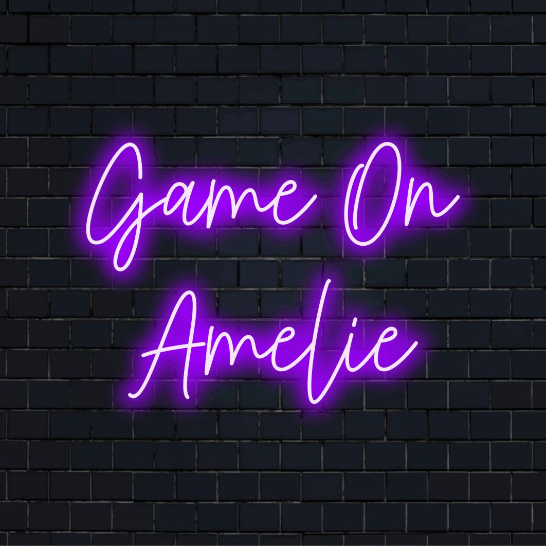 Game On Amelie Custom Name Neon Sign, glowing neon text on dark brick wall