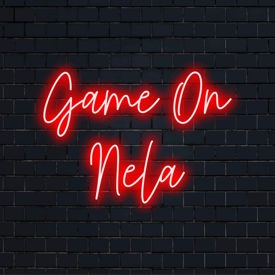 Game On Nela Personalized LED Neon Sign, glowing neon text on black brick background
