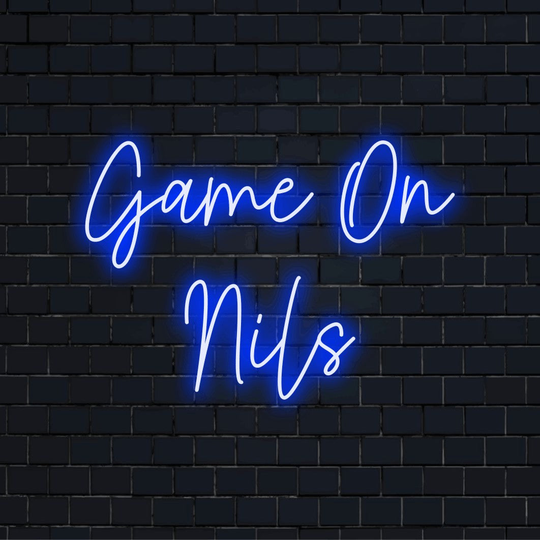 Game On Nils Personalized LED Neon Sign, glowing lettering on dark brick background