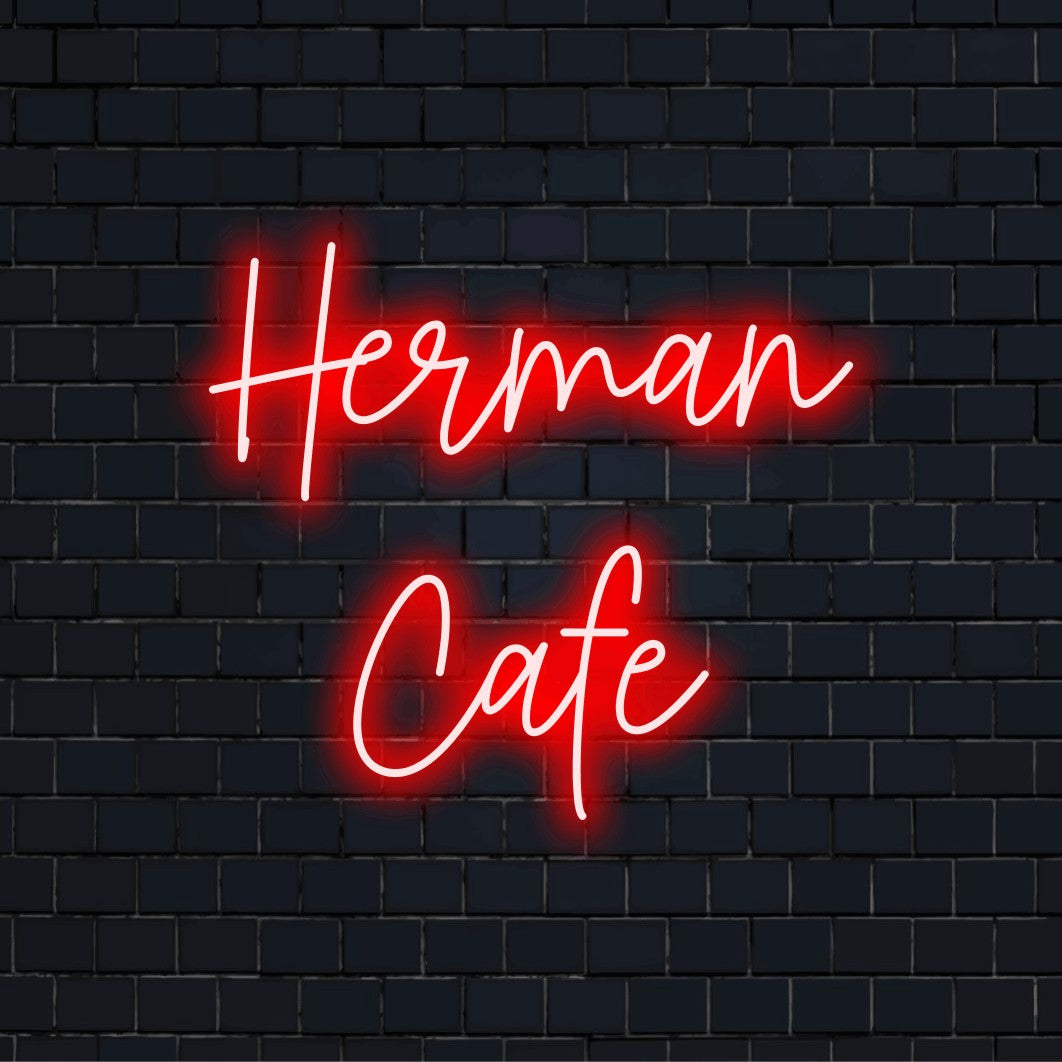 Herman Cafe Personalized Neon Light with glowing lettering on black brick background