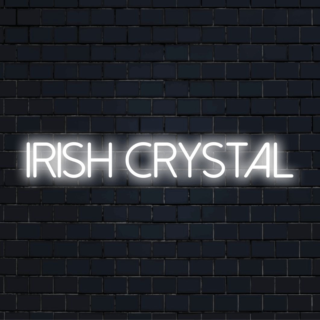 Irish Crystal Neon Sign, glowing neon text against black brick wall