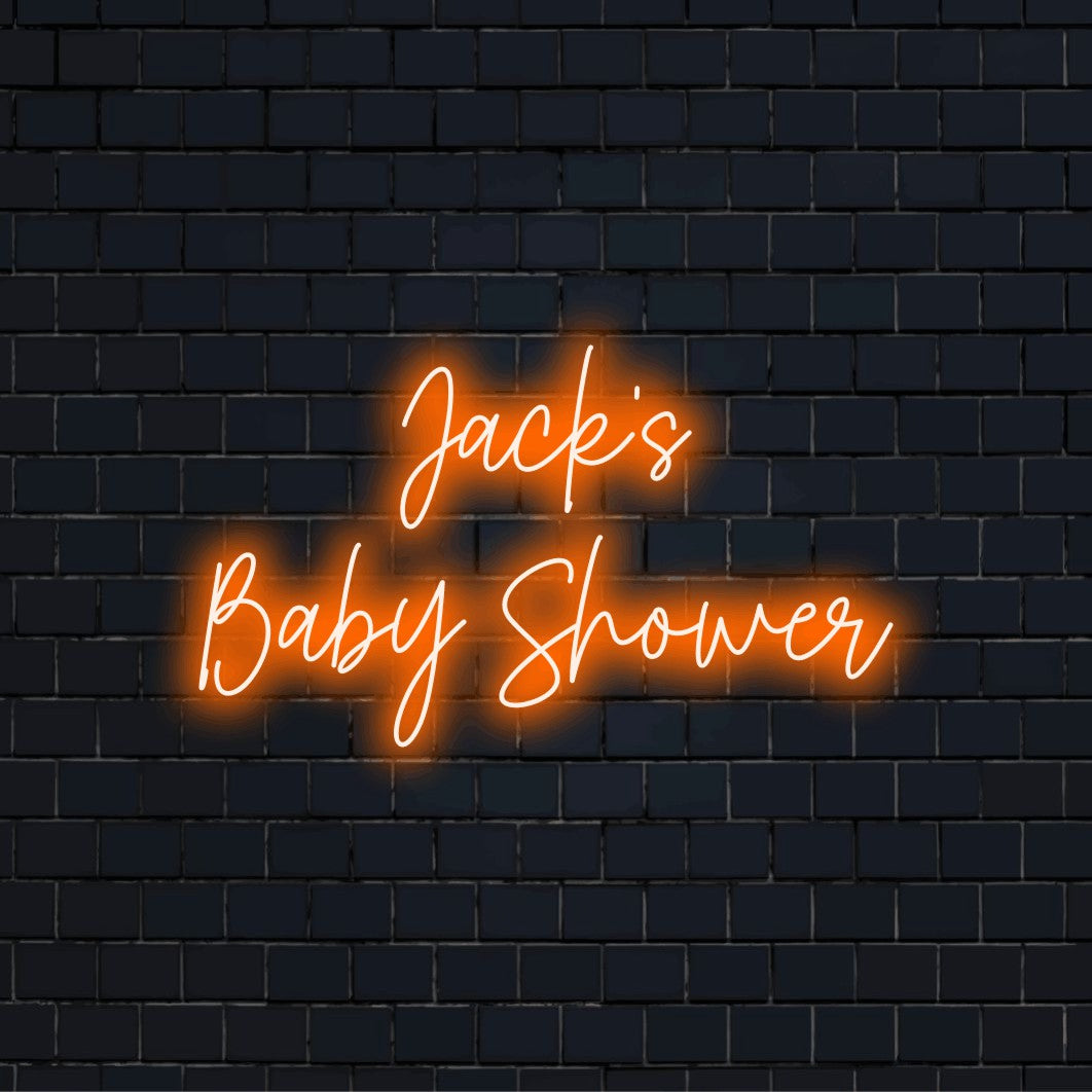 Jack_s Baby Shower Custom Name Neon Sign, neon text light against black brick wall