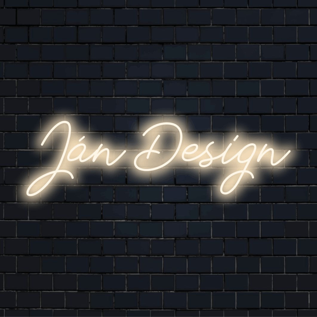 Jan Design Custom Name Neon Sign, glowing lettering against brick backdrop