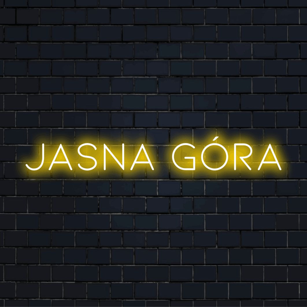 Jasna G Ra LED Neon Sign, bright neon lettering on black brick background