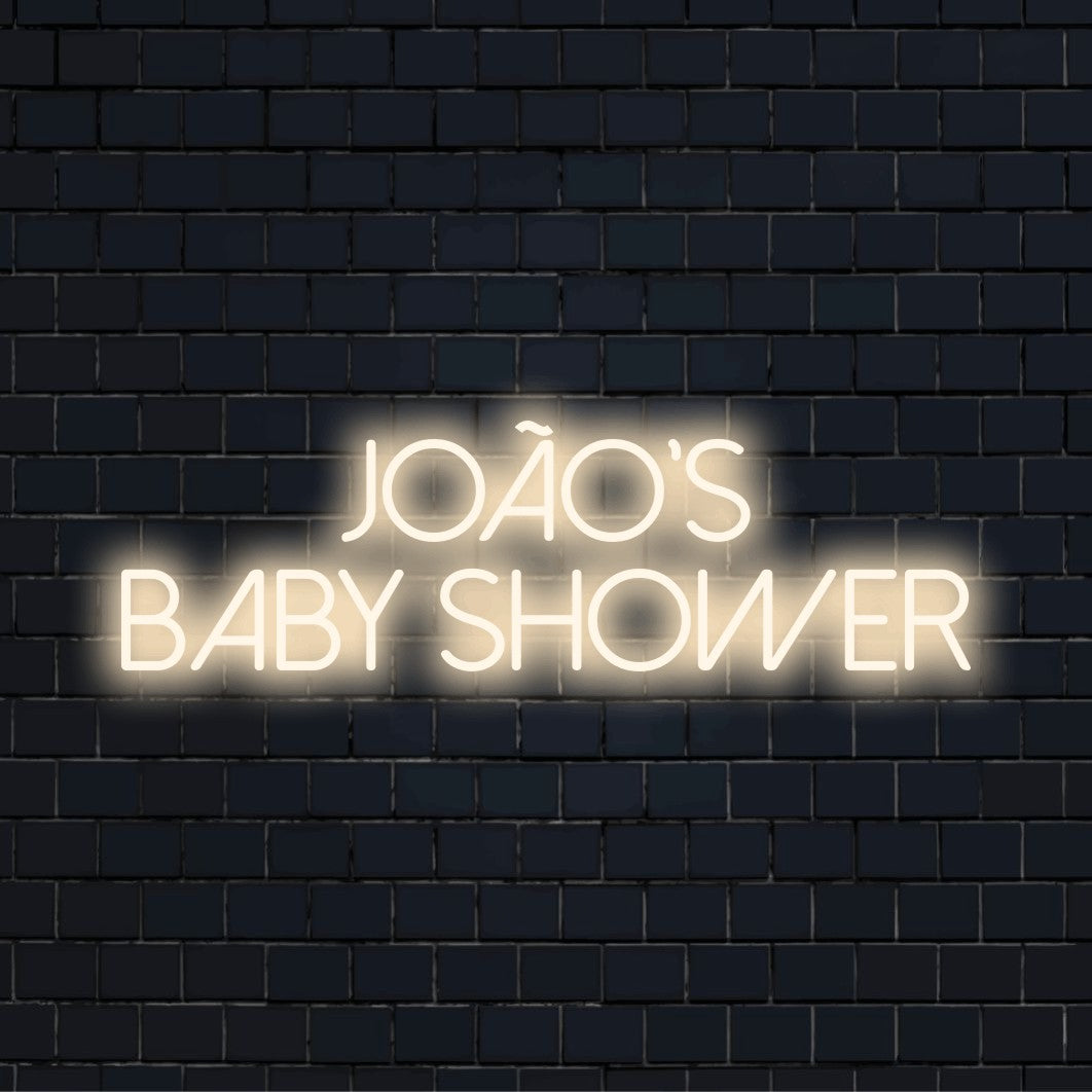 Joao_s Baby Shower Personalized LED Neon Sign, bright LED glow on dark brick wall