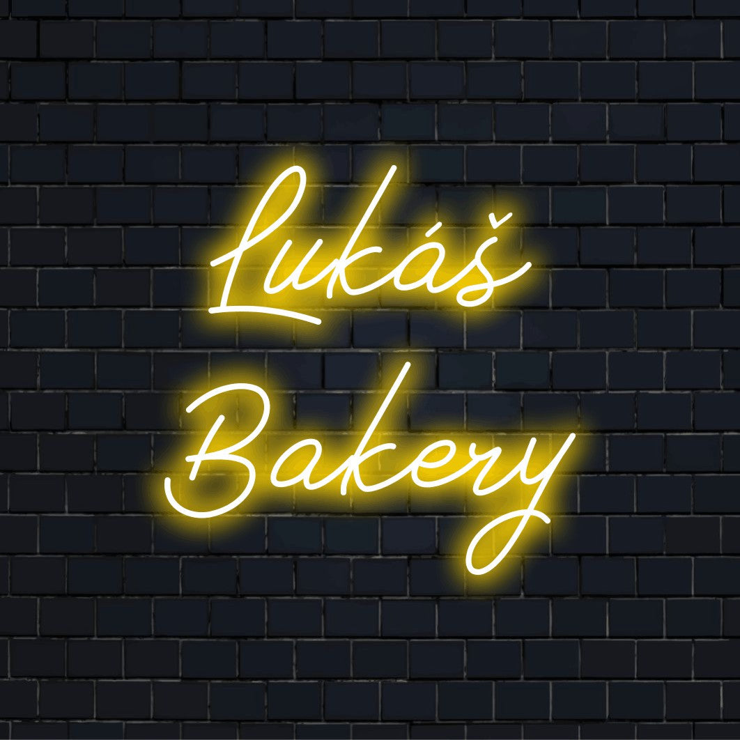 Lukas Bakery Personalized Neon Light with glowing neon text on dark brick background