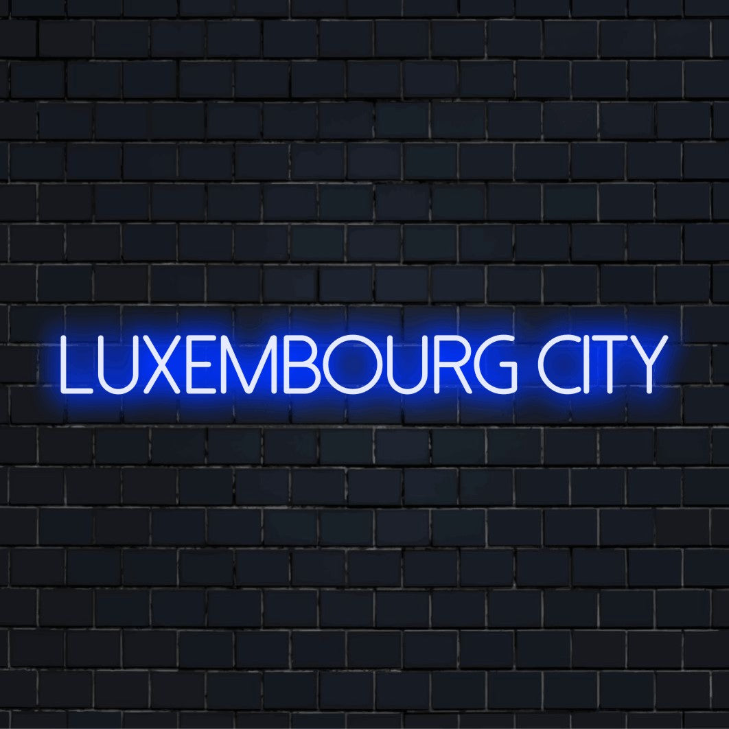 Luxembourg City Neon Light with neon text light against brick backdrop
