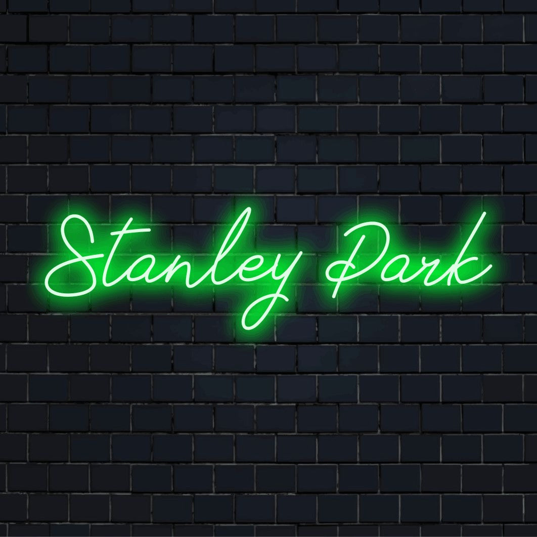 Stanley Park Neon Sign, bright neon glow on dark brick background