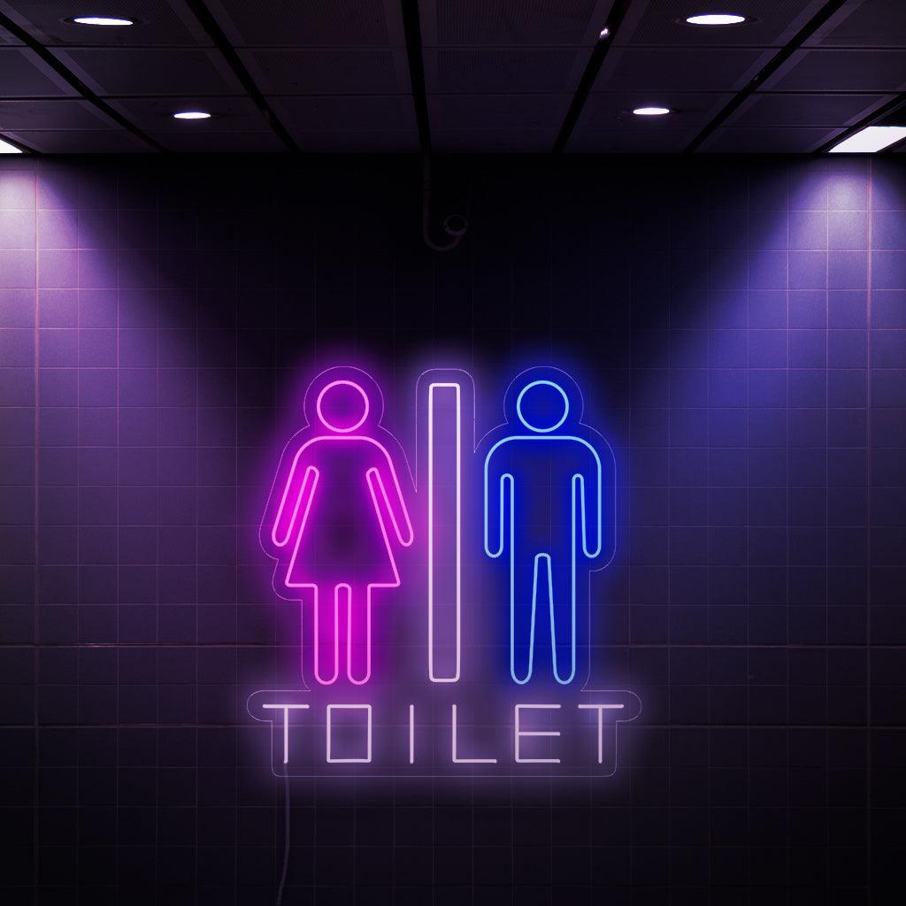 A captivating neon sign featuring a woman and a man symbol, along with the word 'Toilet'. This unique sign adds a touch of style and functionality to restroom facilities, making it easy for both genders to locate the bathroom.