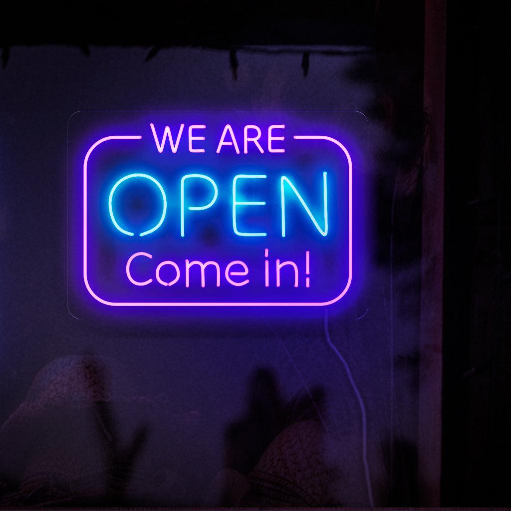 A captivating neon sign with bold, glowing letters that spell out 'We Are Open. Come In.'