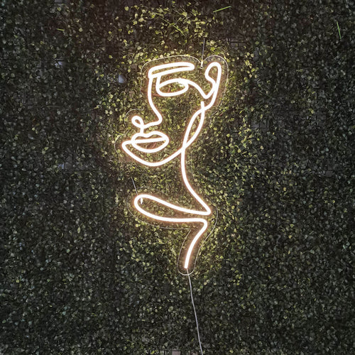 Insegna al neon con volto di donna astratta - The Art Neon