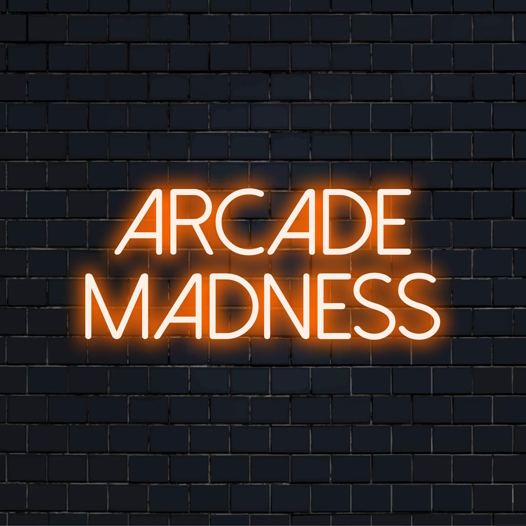 Arcade Madness neon sign emits vibrant glow, perfect for game room ambiance; custom LED wall art for nostalgic decor.