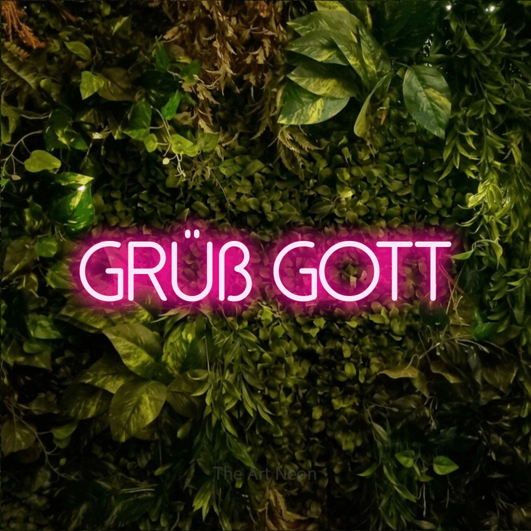 LED neon sign reading “grüß gott”, arranged in a single line.