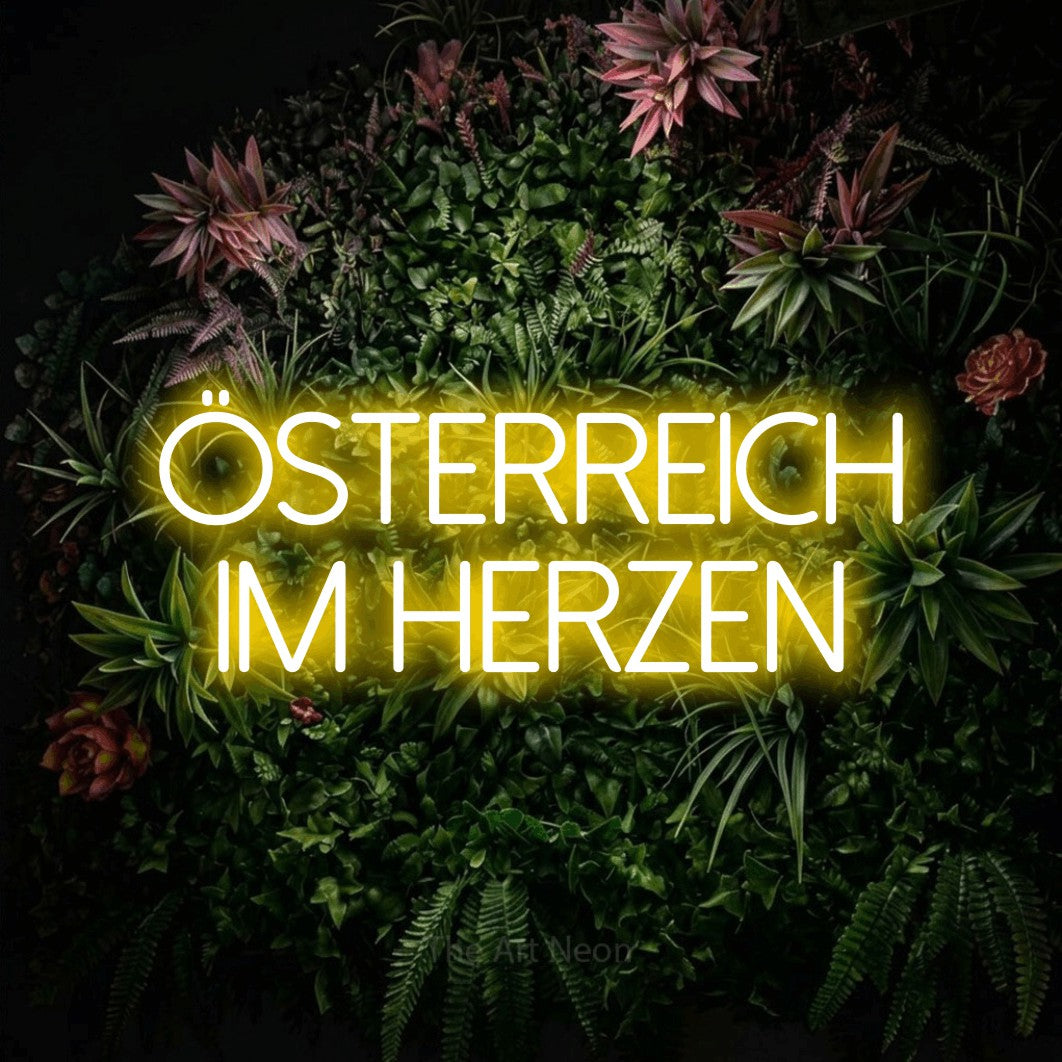 LED neon sign reading “ÖSTERREICH IM HERZEN”, arranged in 2 lines.