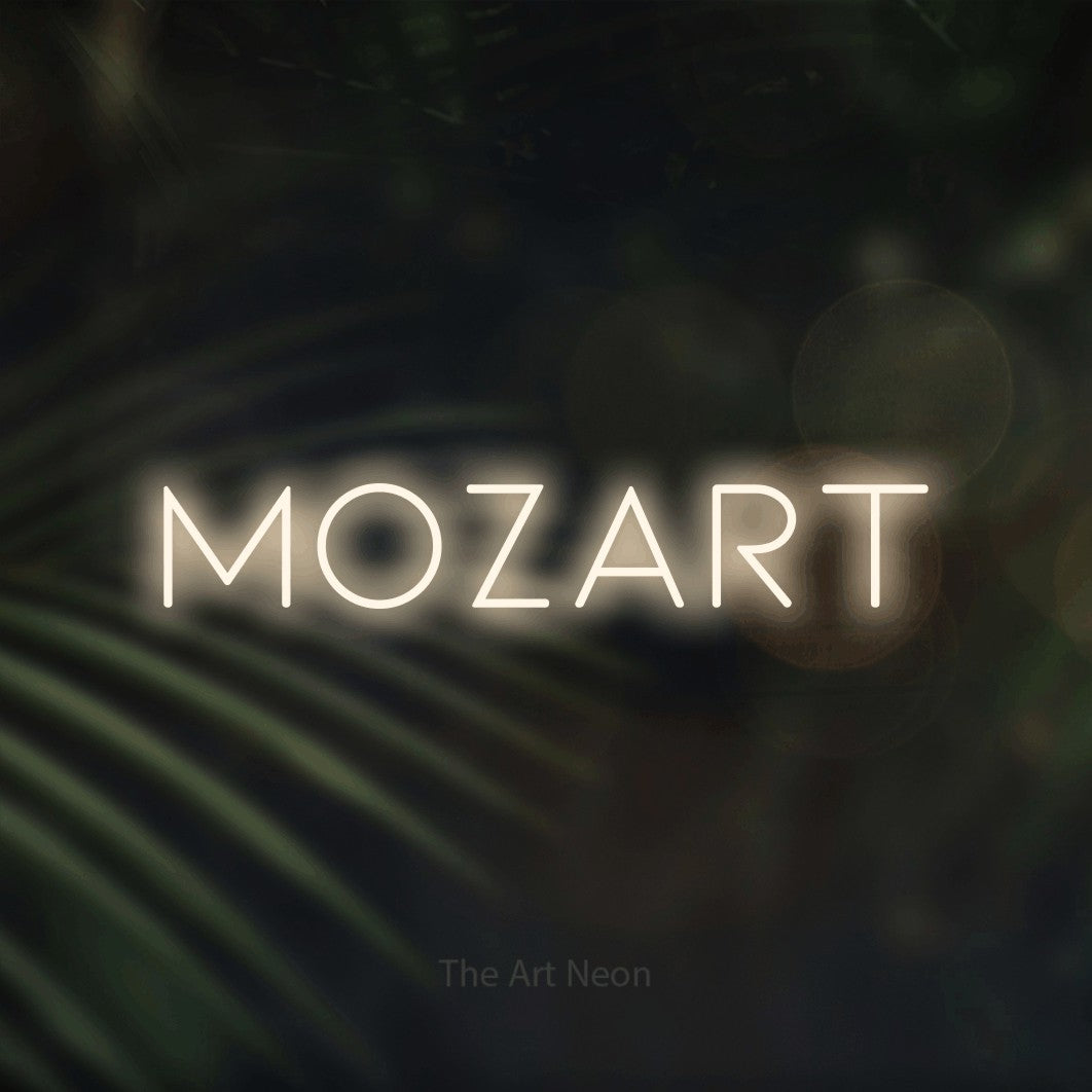 LED neon sign reading “mozart”, arranged in a single line.