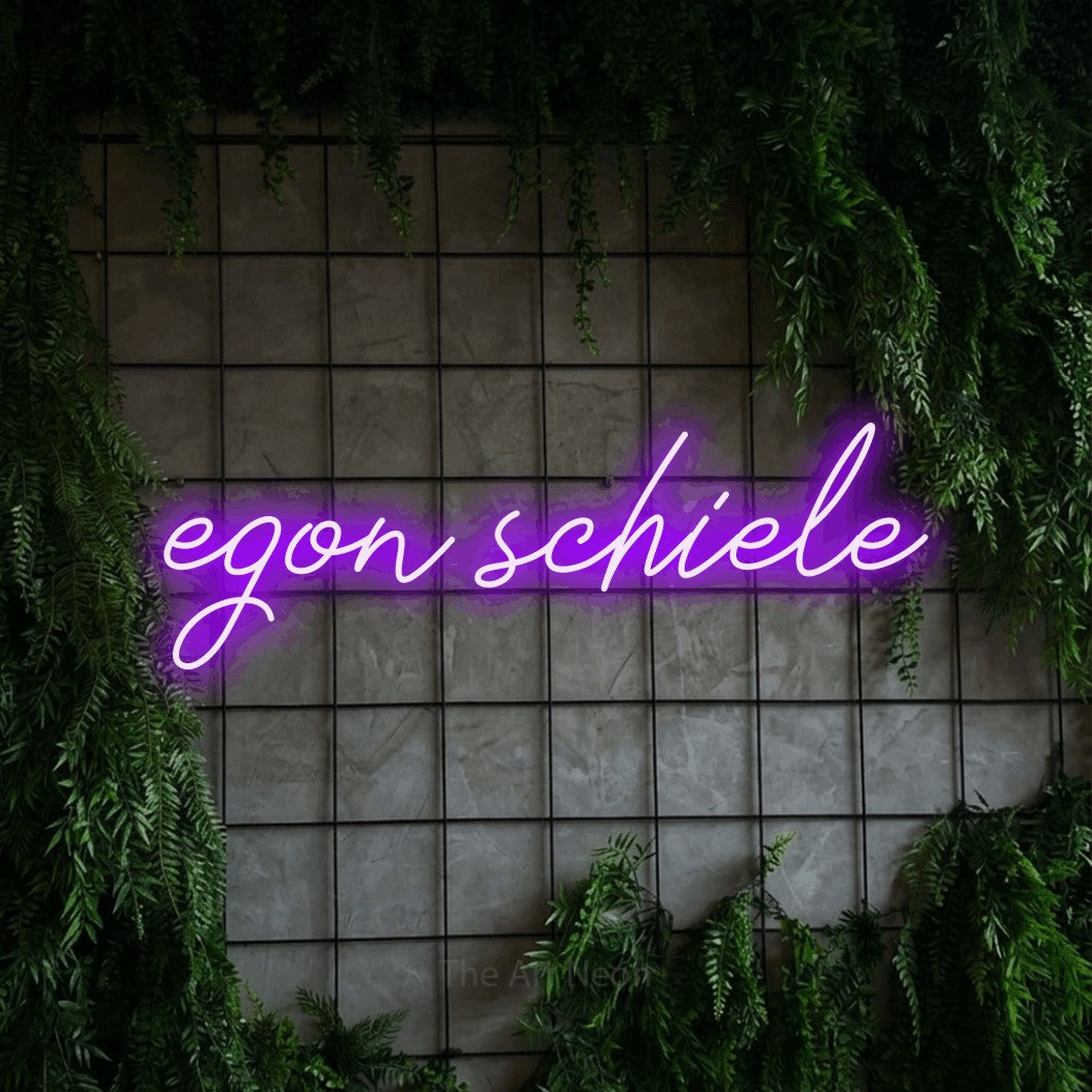 LED neon sign reading “egon schiele”, arranged in a single line.