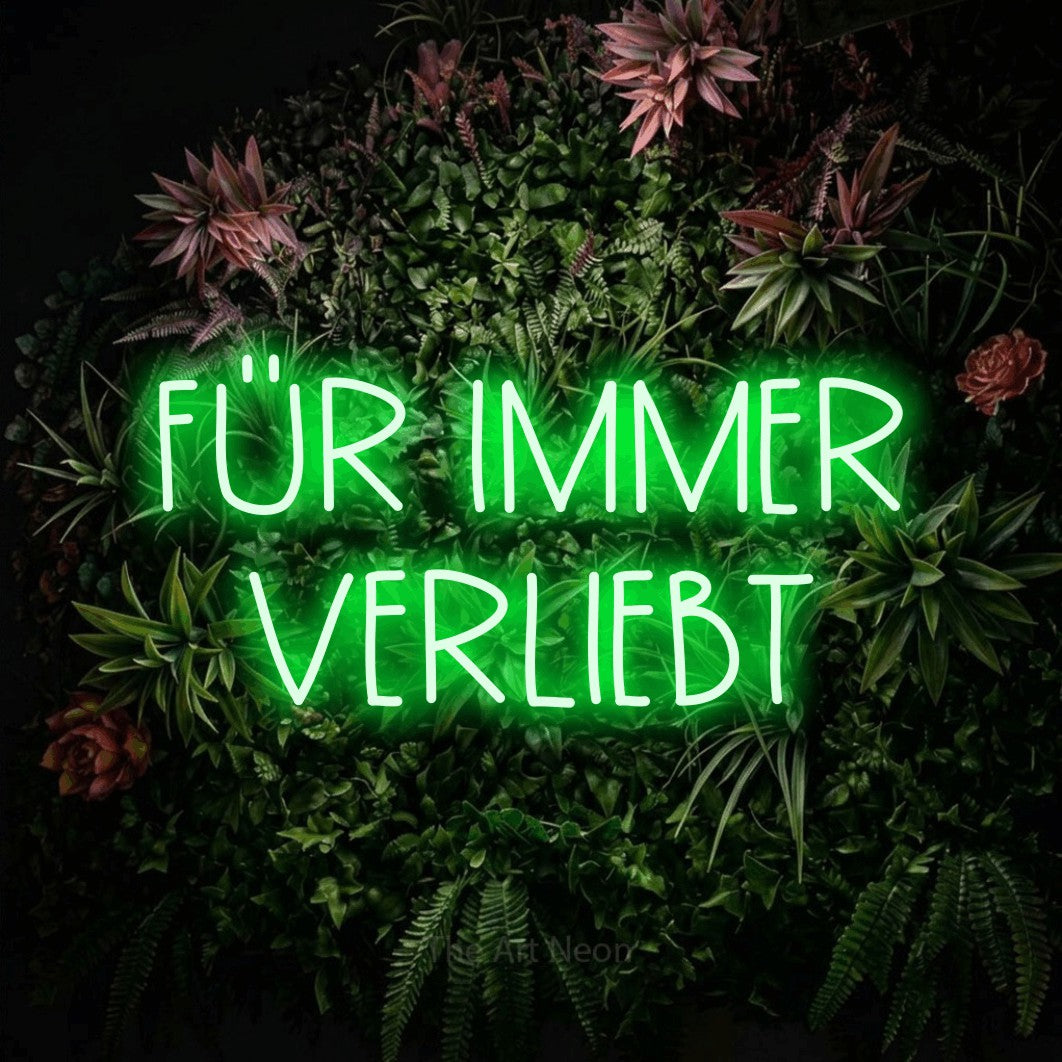 LED neon sign reading “FÜR IMMER VERLIEBT”, arranged in 2 lines.