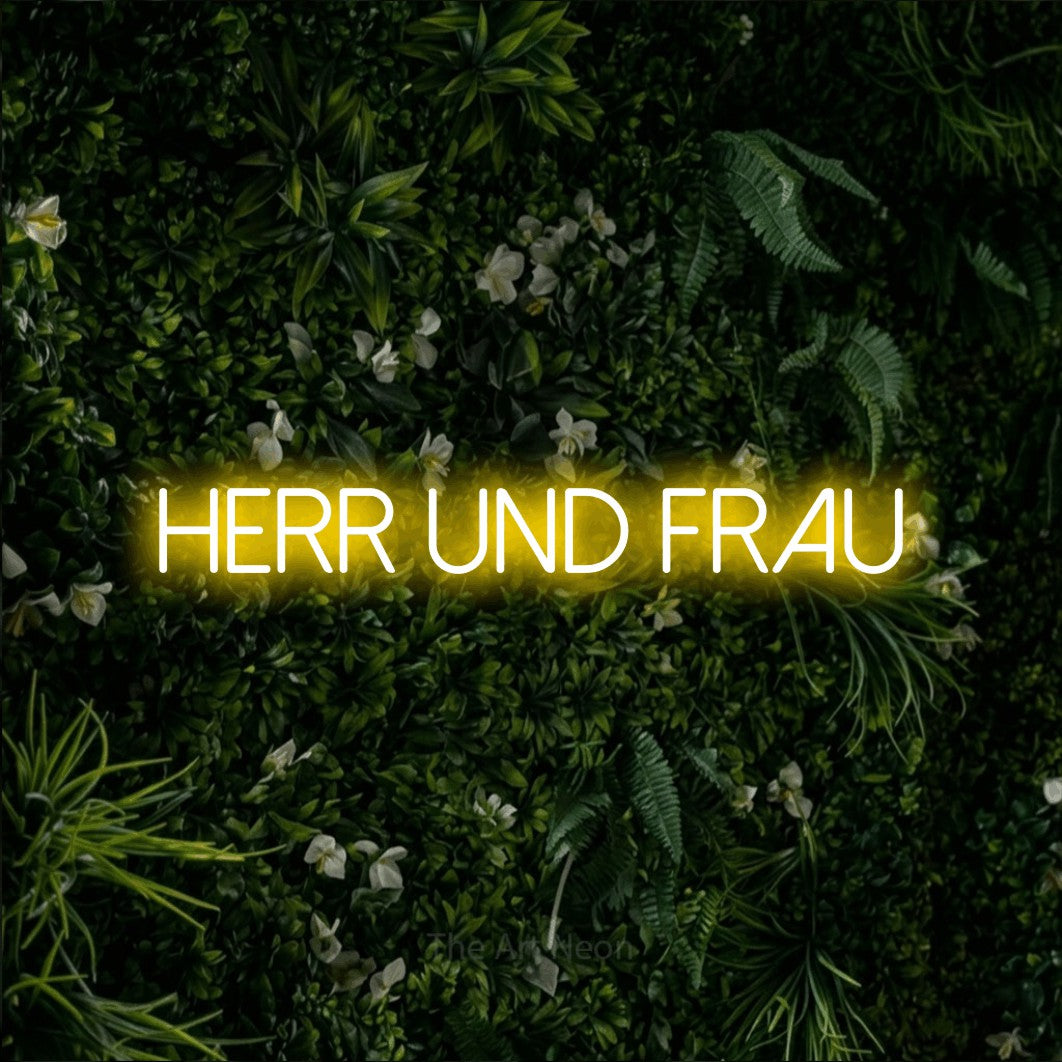 LED neon sign reading “HERR UND FRAU”, arranged in a single line.