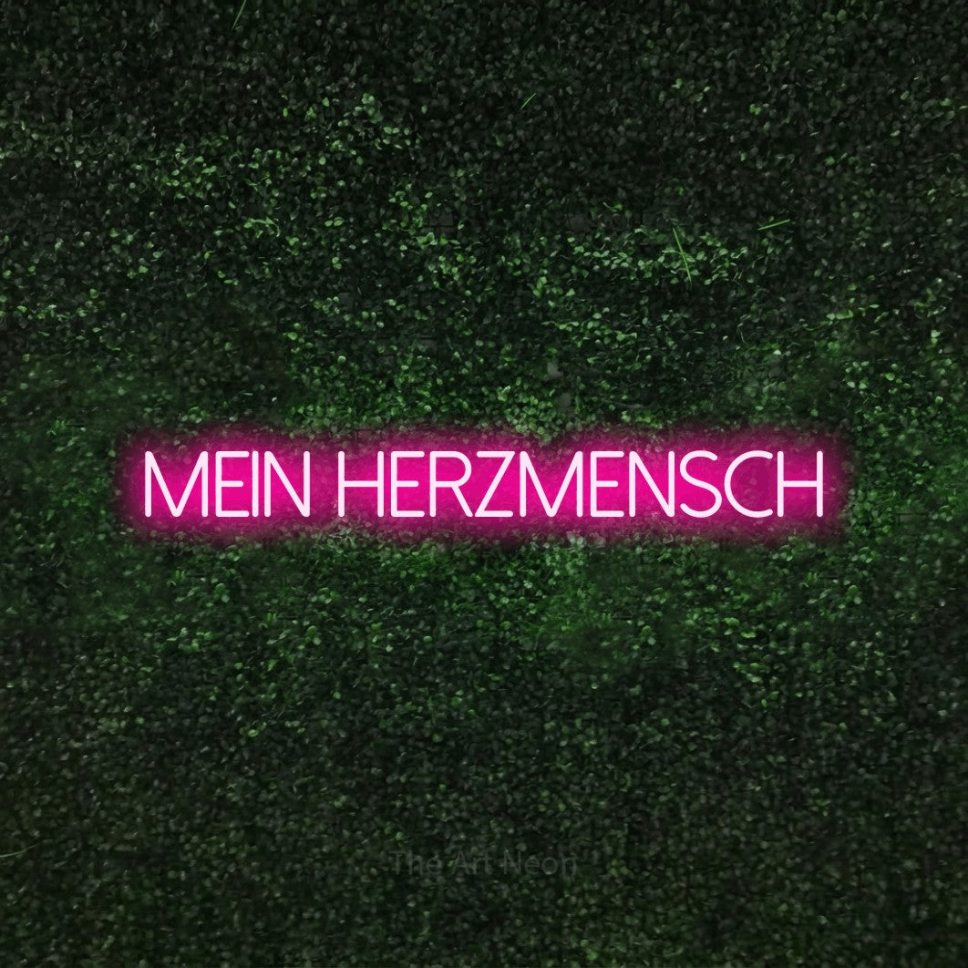 LED neon sign reading “mein herzmensch”, arranged in a single line.
